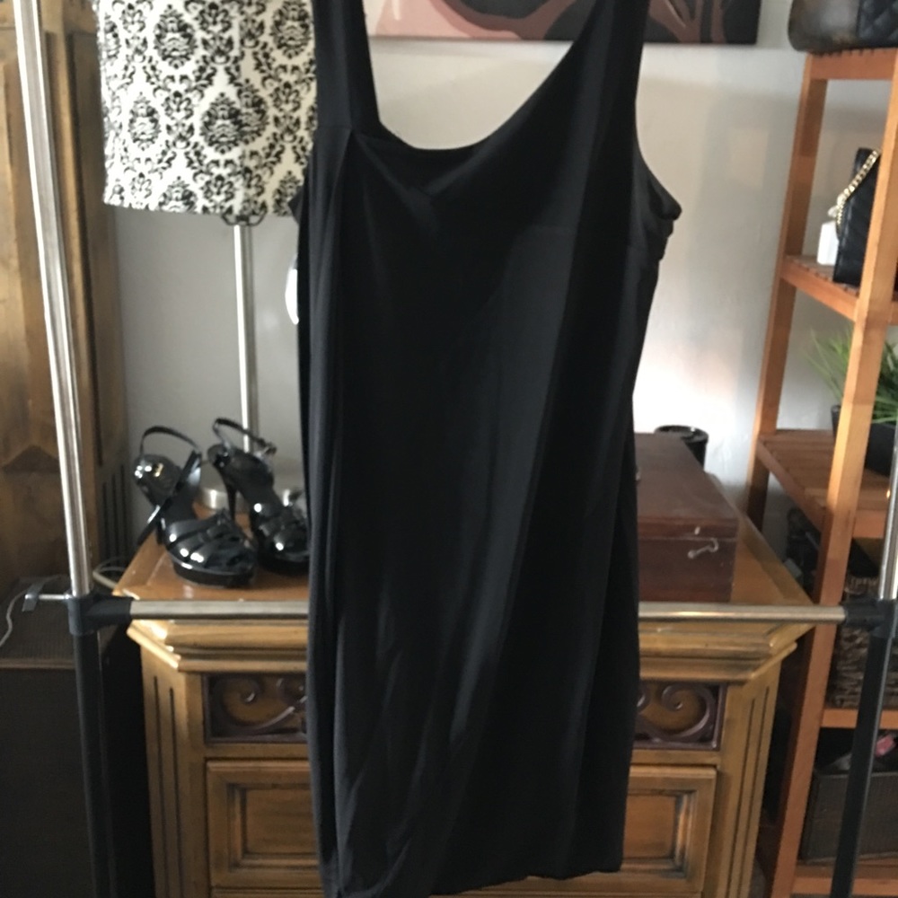 Perfect black dress with interesting bottom.